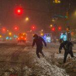 Storm dumps snow and ice on East Coast, shutting schools and virus testing in US